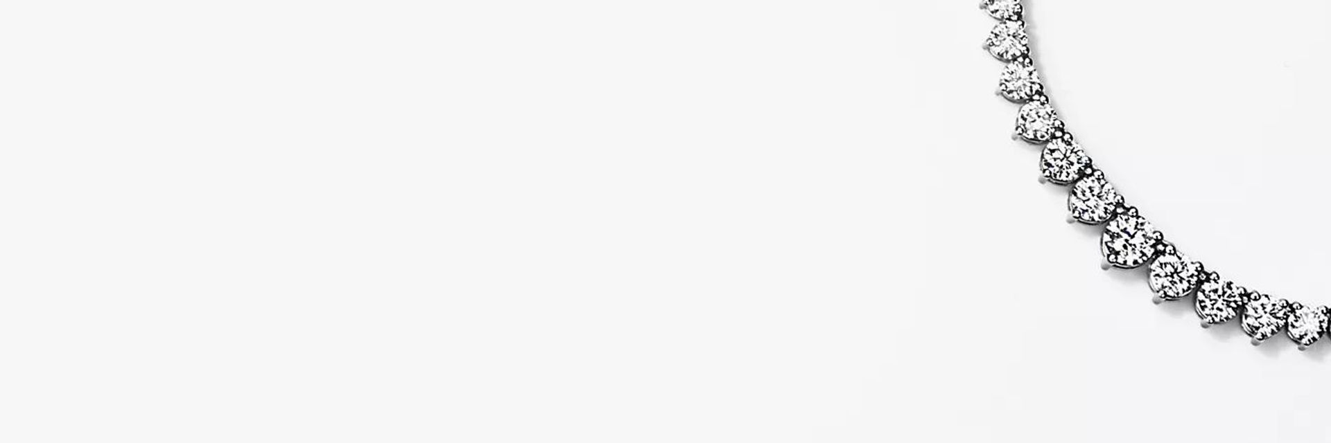 Eternity graduated diamond necklace in 18k white gold.