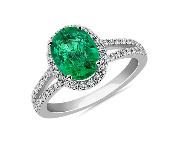 Oval Emerald and Diamond Halo Split Shank Ring in 14k White Gold (9x7mm)